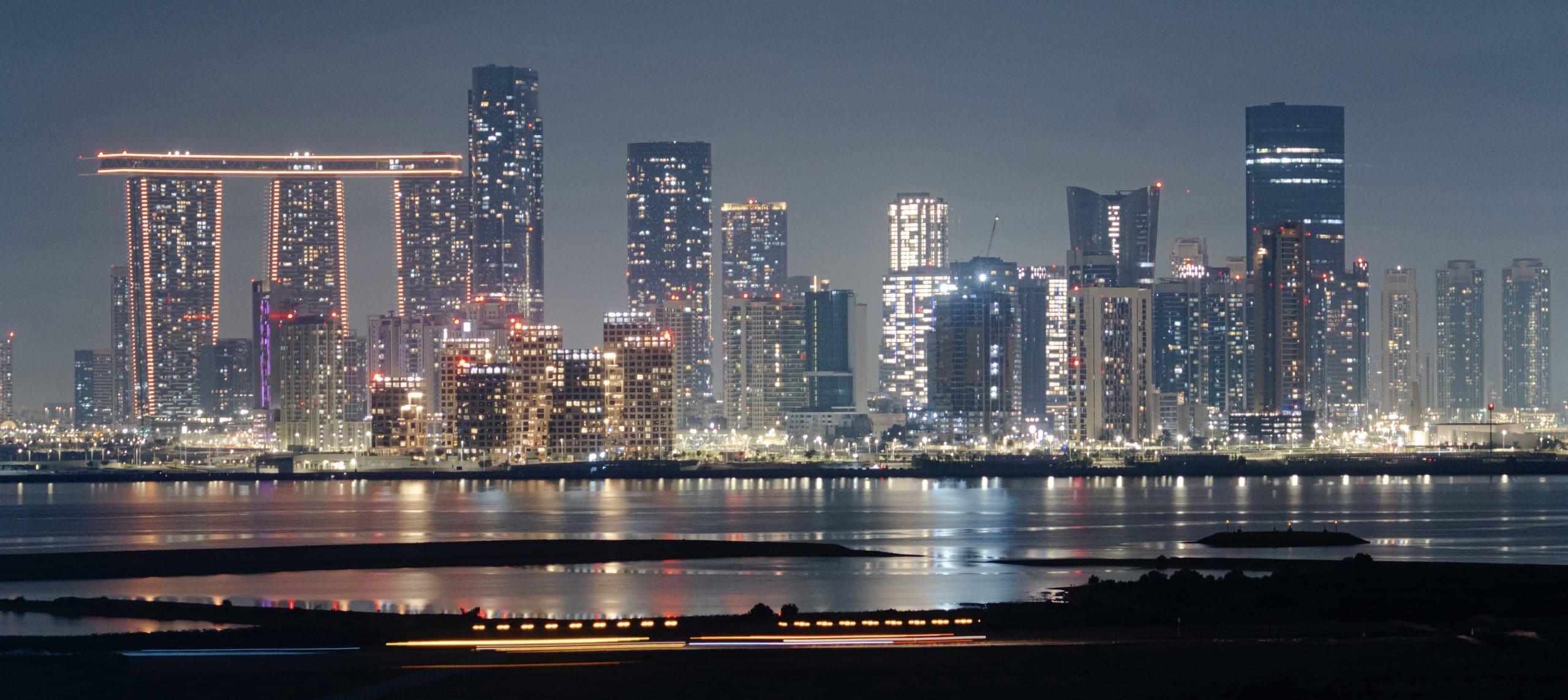 Al Reem Island across the water at night